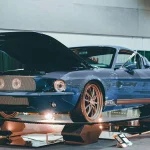 The Rise of the Young Collector: Why Gen X and Millennial Buyers Are Reshaping the Market Blue vintage car with hood open on display