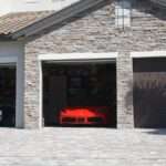 10 Garage Gadgets Every Car Collector Wishes They Bought Sooner a car is parked in the garage of a house