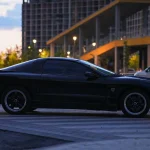The Most Undervalued Collector Cars In Today's Market A black sports car parked on the side of the road