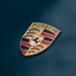 Porsche's 16% Sales Drop Hides a Deliberate Lineup Overhaul red and yellow logo on black background