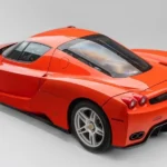 Red Ferrari Enzo, the 399-unit V12 flagship that headlined Broad Arrow's 2026 Quail Auction