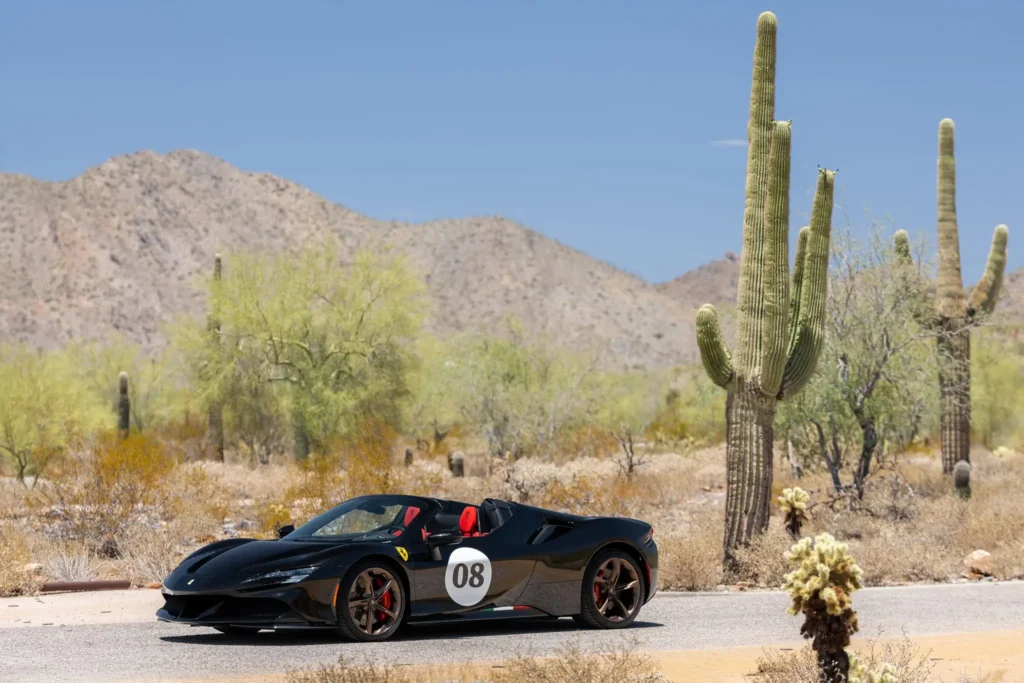 Rear three-quarter view of the Atelier Ferrari SF90 Spider showing the tri-color livery and matte bronze wheels