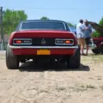 10 Coolest Restomods for Sale Right Now a red car parked on top of a dirt road