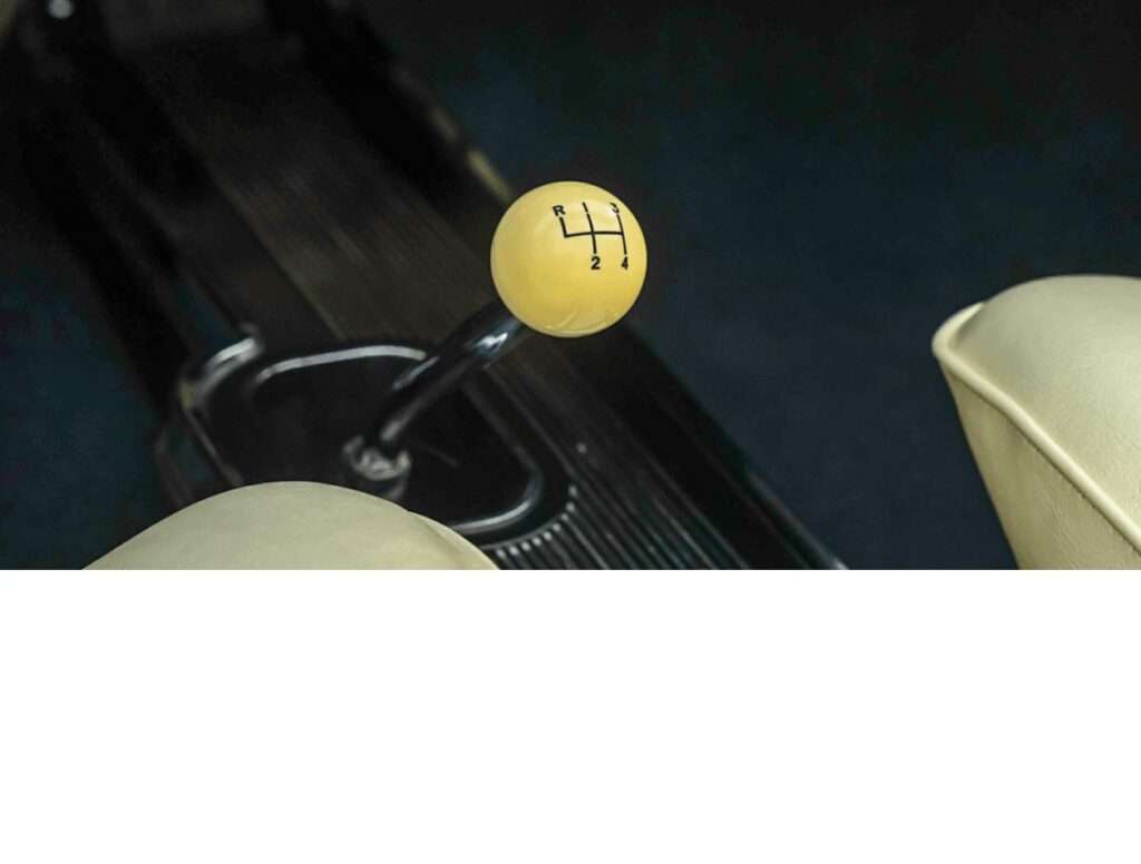 Close-up of the GTO's original 4-speed manual shifter with white shift ball