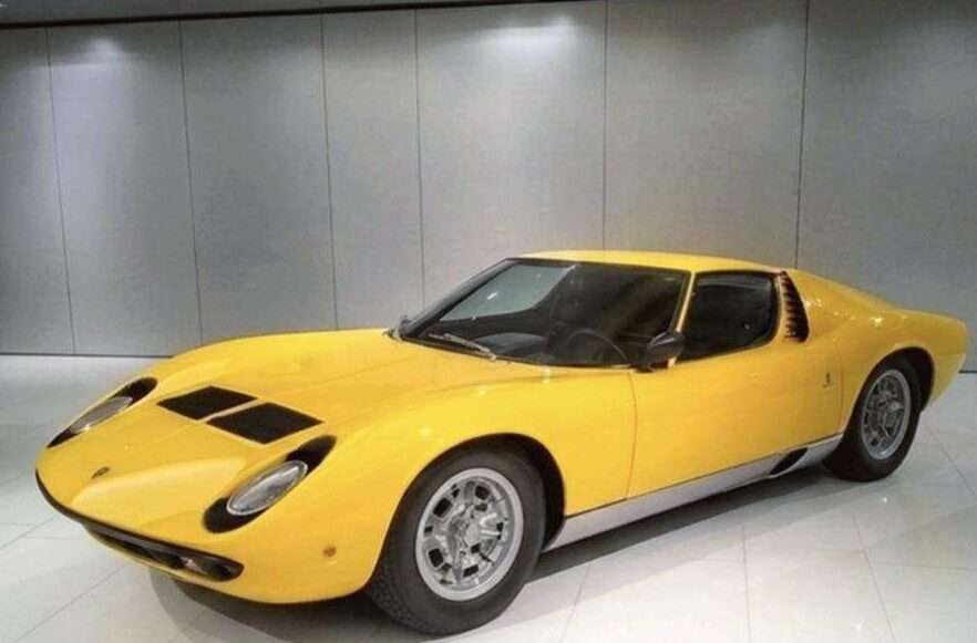 1967 Lamborghini Miura P400 in yellow, studio front three-quarter view