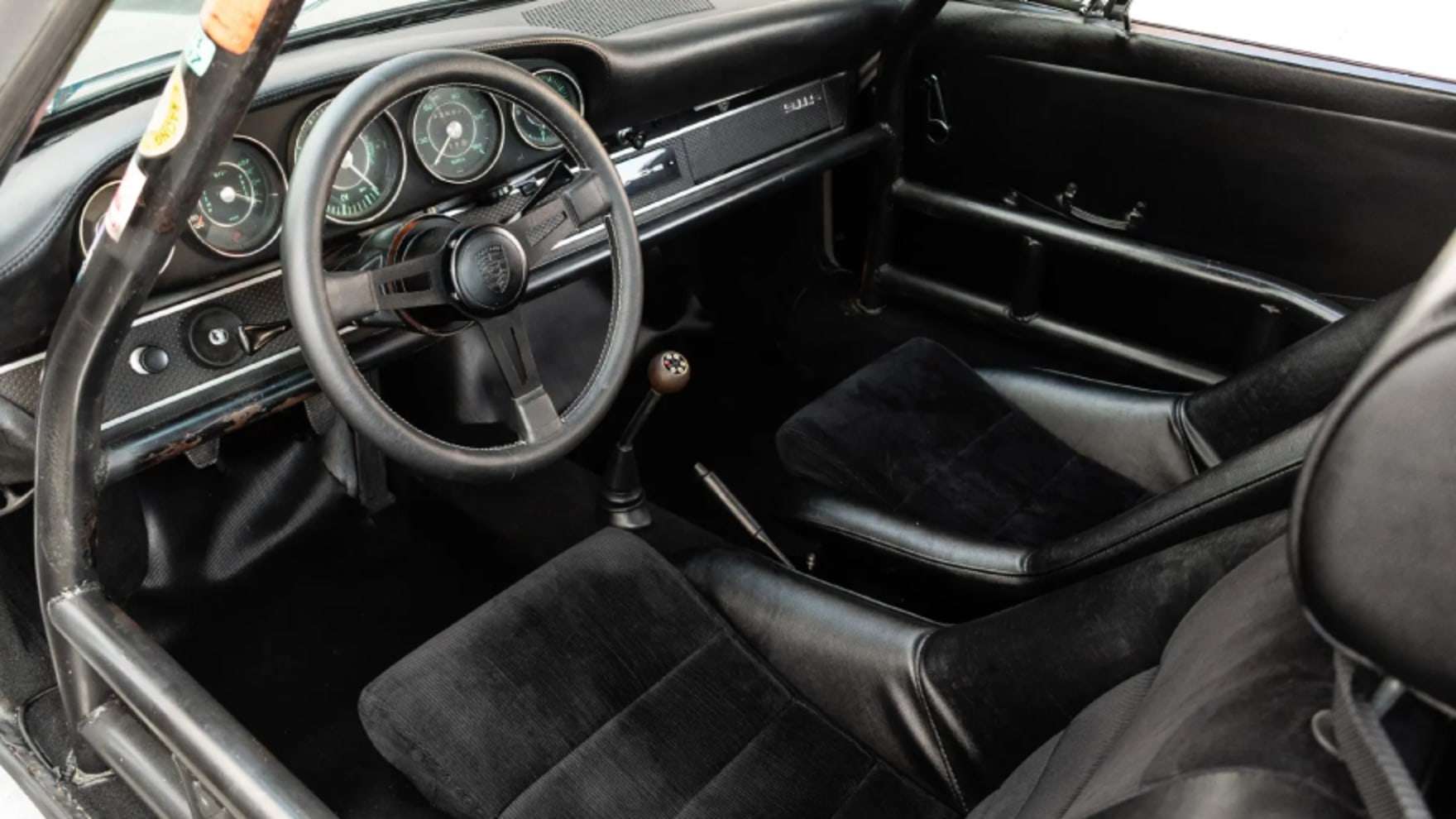 1967 Porsche 911S cockpit interior with steering wheel and analog gauges