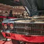 The Real Story in Columbus Wasn't Ford vs. Chevrolet. It Was Provenance vs. Craftsmanship. Classic blue car with hood open at an exhibition.