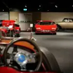 a group of cars parked next to each other in a garage