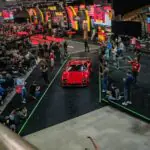 Mecum Monterey 2026 Delivers a Record $14.575 Million Ferrari F50 and 23 Million-Dollar Cars Red sports car drives through auction crowd