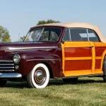 Award-Winning 1947 Ford Super Deluxe Sportsman For Sale at Aumann Auctions 1947 Ford Super Deluxe Sportsman in Monsoon Maroon with mahogany and maple wood body, front three-quarter view