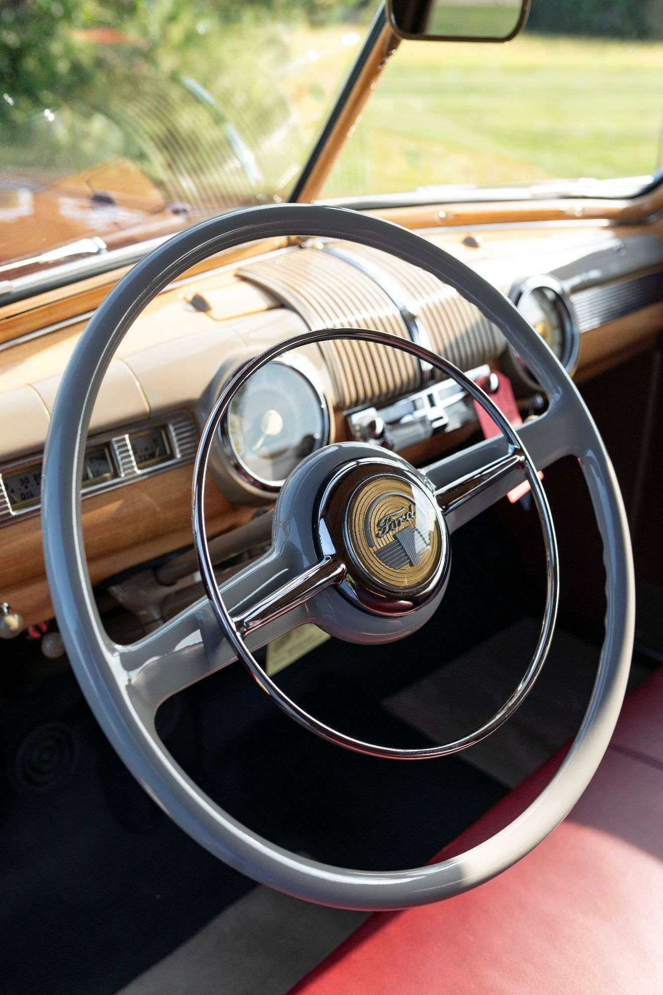 Steering wheel and woodgrain dashboard of the 1947 Ford Sportsman