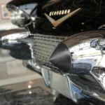 Front grille, quad headlamps and chrome bumper guards of a black 1957 Cadillac Eldorado Brougham