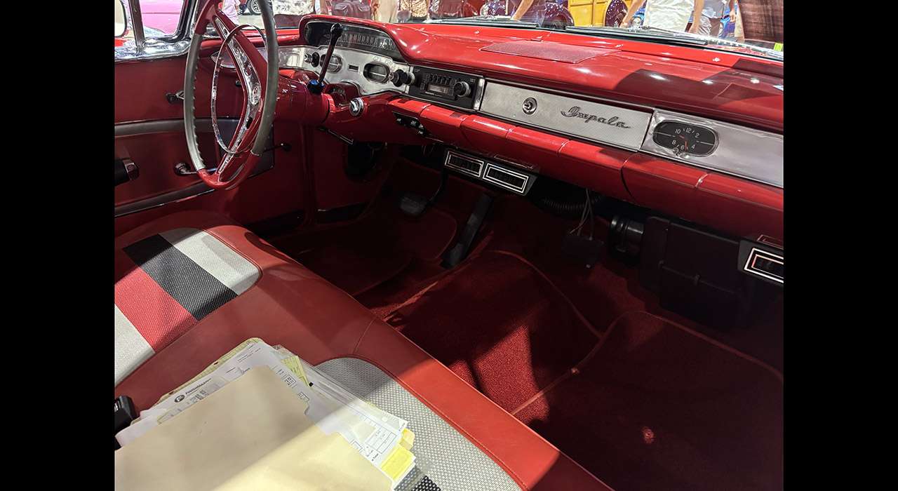 1958 Chevrolet Impala dashboard and red two-tone bench seat
