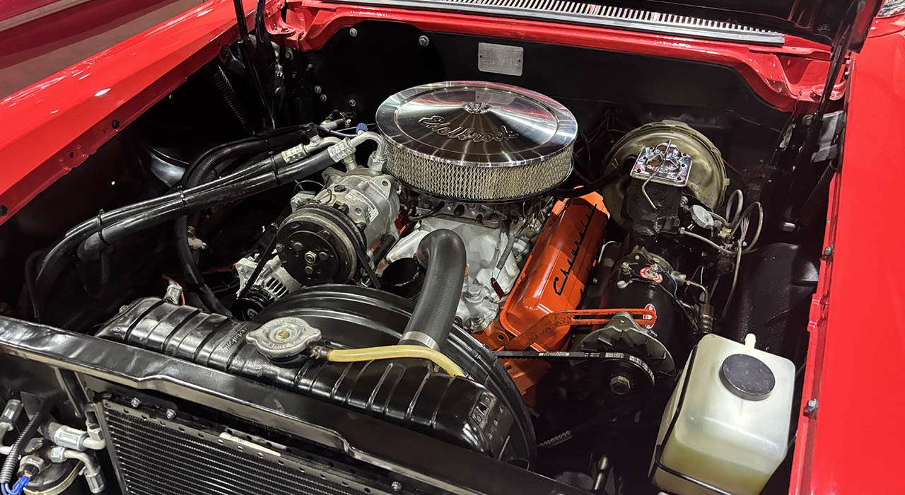 V8 engine bay of the 1958 Chevrolet Impala with orange block and chrome air cleaner