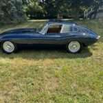1964 Jaguar XKE Series 1 3.8 Competition front three-quarter view at the Saratoga Motorcar Auction