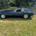 1964 Jaguar XKE Series 1 3.8 Competition front three-quarter view at the Saratoga Motorcar Auction