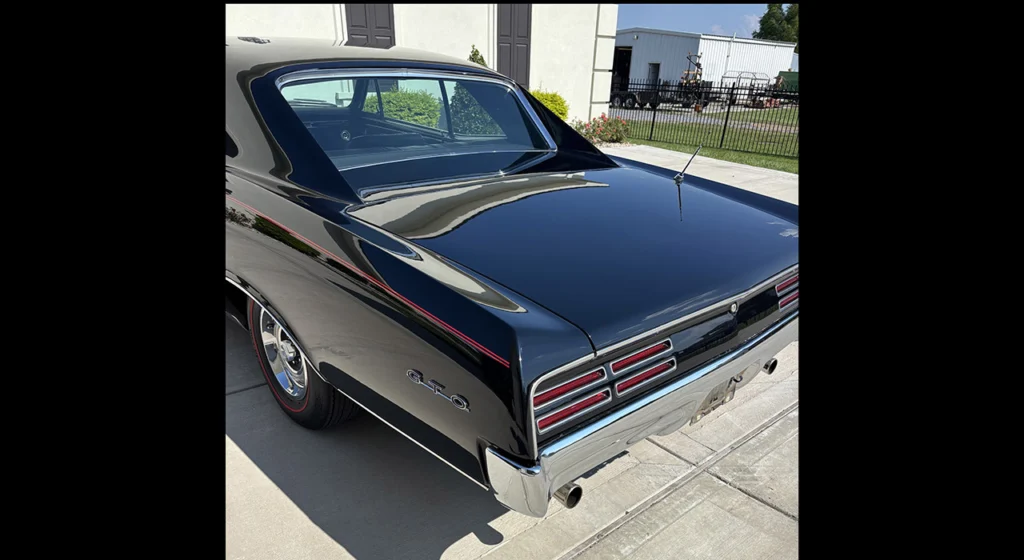 Rear three-quarter view of the 1967 Pontiac GTO showing its louvered taillights
