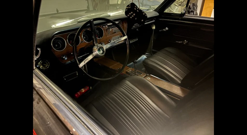 Black interior of the 1967 Pontiac GTO with console and His and Hers shifter