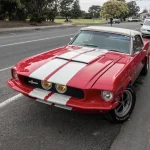 Today in Collector Car History: 'Little Red' Met Its Only Surviving Shelby GT500 Sibling for the First Time, 5 Years Ago Today Red 1967 Shelby GT500 fastback with white racing stripes, front three-quarter view