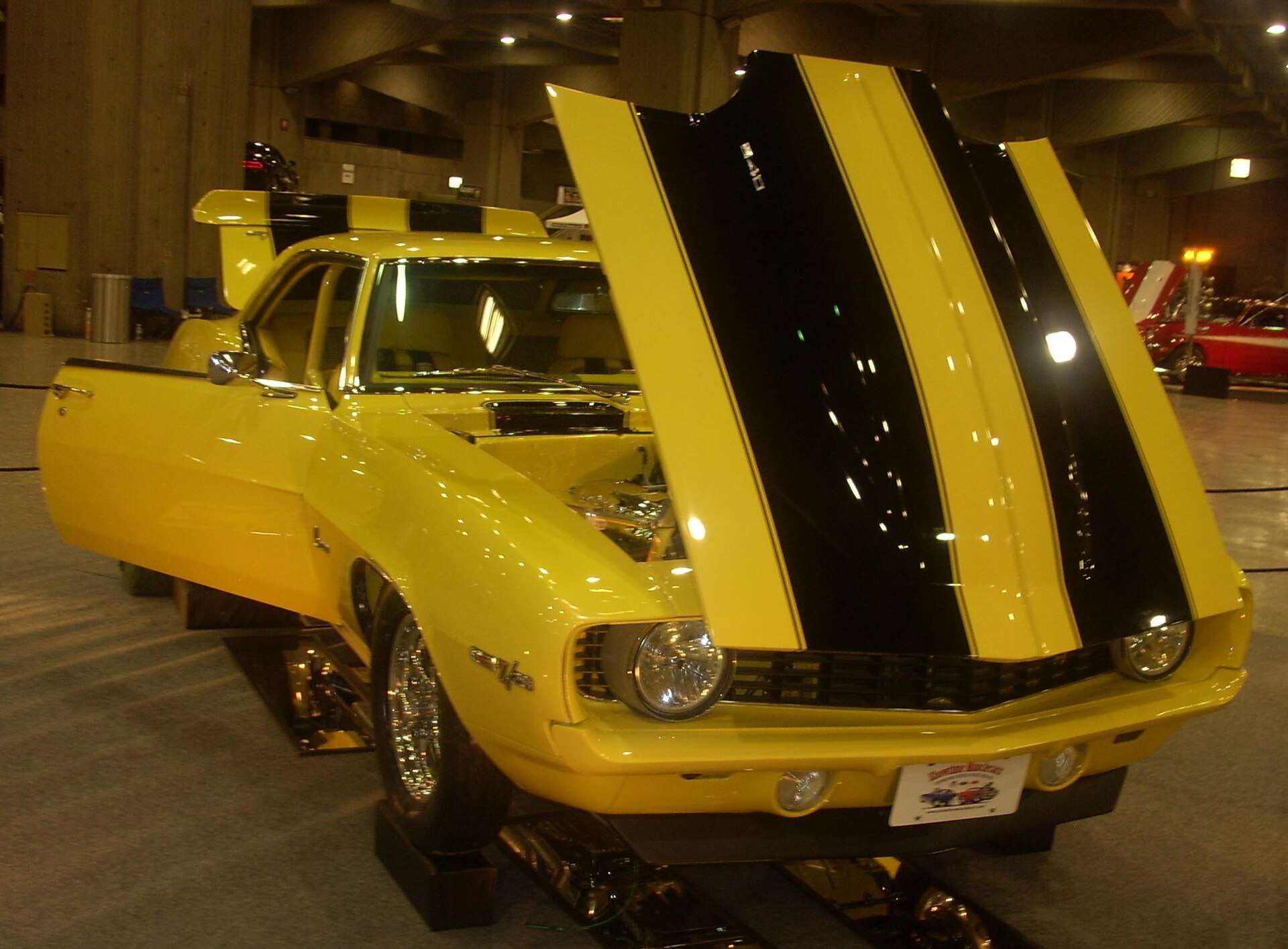 1969 Chevrolet Camaro Z28 with rally stripes at a car show