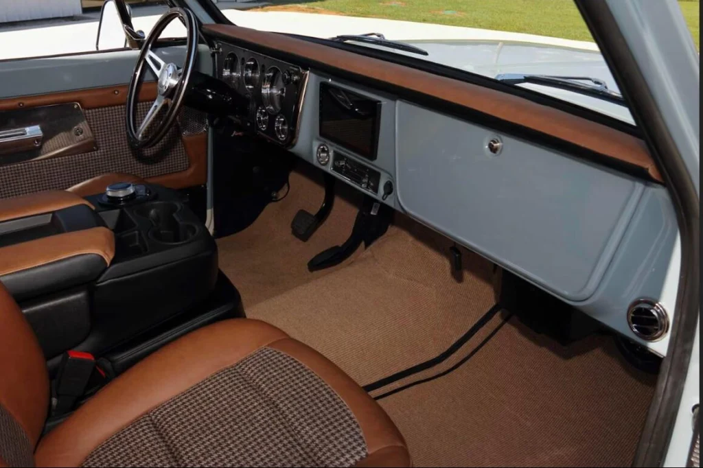 Interior of the 1969 Chevrolet K5 Blazer Custom showing brown leather seats and steering wheel, for sale from the Rick Yerick Collection Auction
