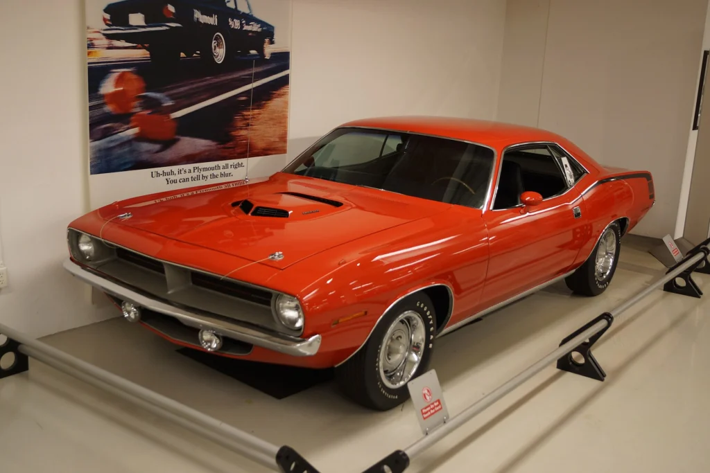 1970 Plymouth Hemi 'Cuda in orange on museum display, front three-quarter view
