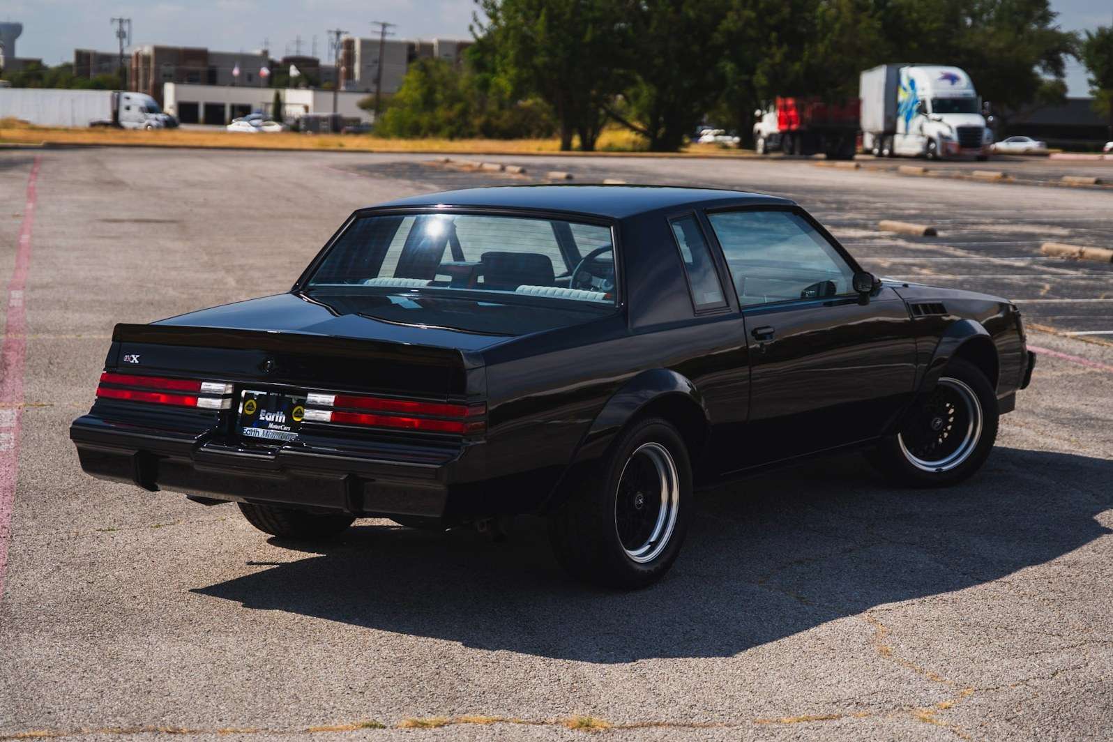 Rear three-quarter view of 1987 Buick GNX #450 showing the three-piece spoiler