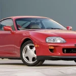 1993 Toyota Supra Turbo 6-speed in Renaissance Red, front three-quarter view