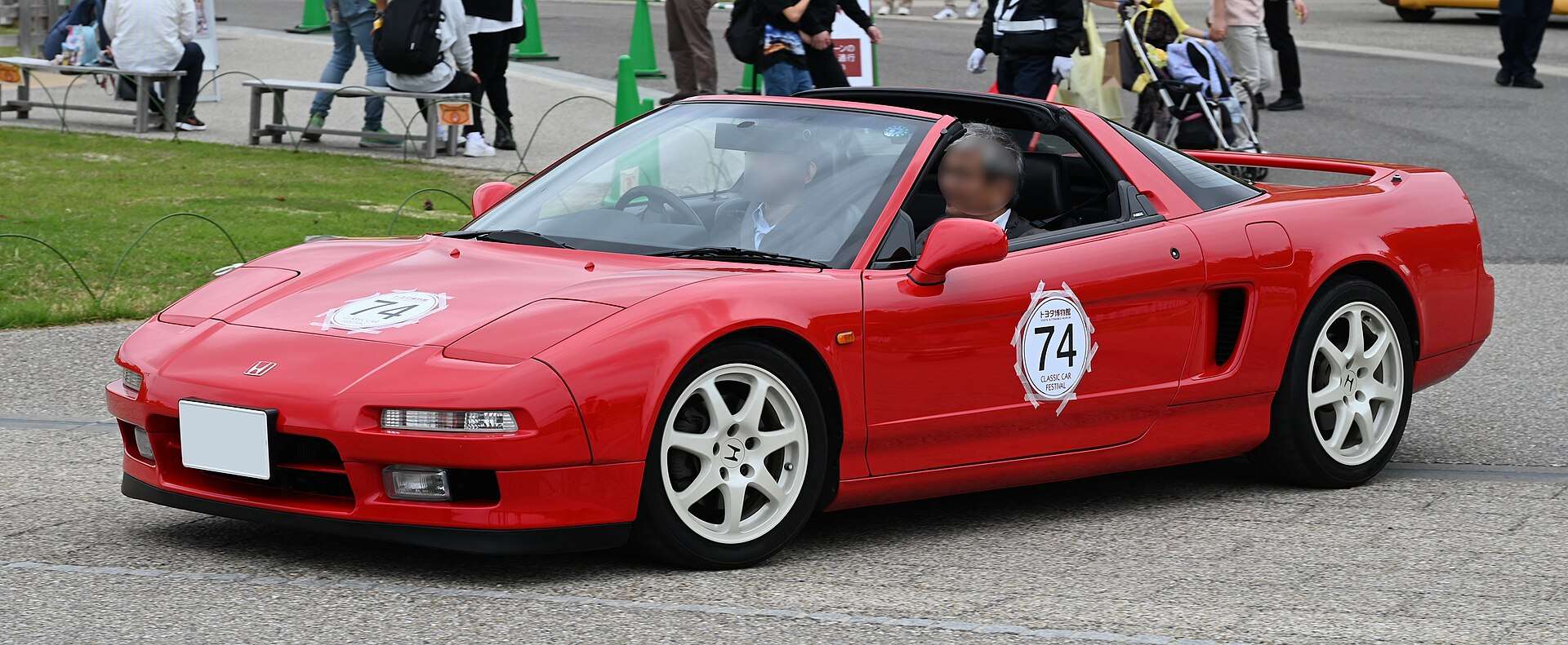 Red 1995 Honda NSX Type T with its removable targa roof panel stowed, at a vintage rally