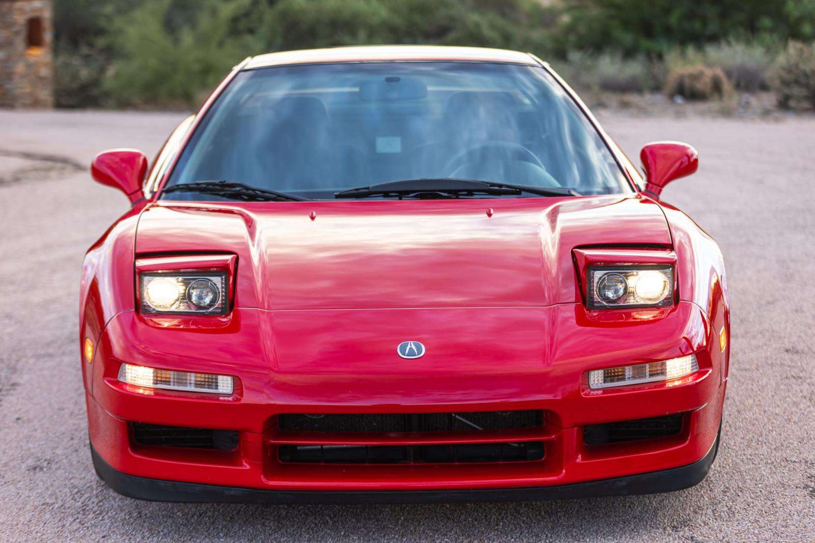 Front view of 1999 Acura NSX Zanardi Edition with pop-up headlights raised