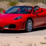 2006 Ferrari F430 Spider 6-speed in Rosso Corsa, front three-quarter view