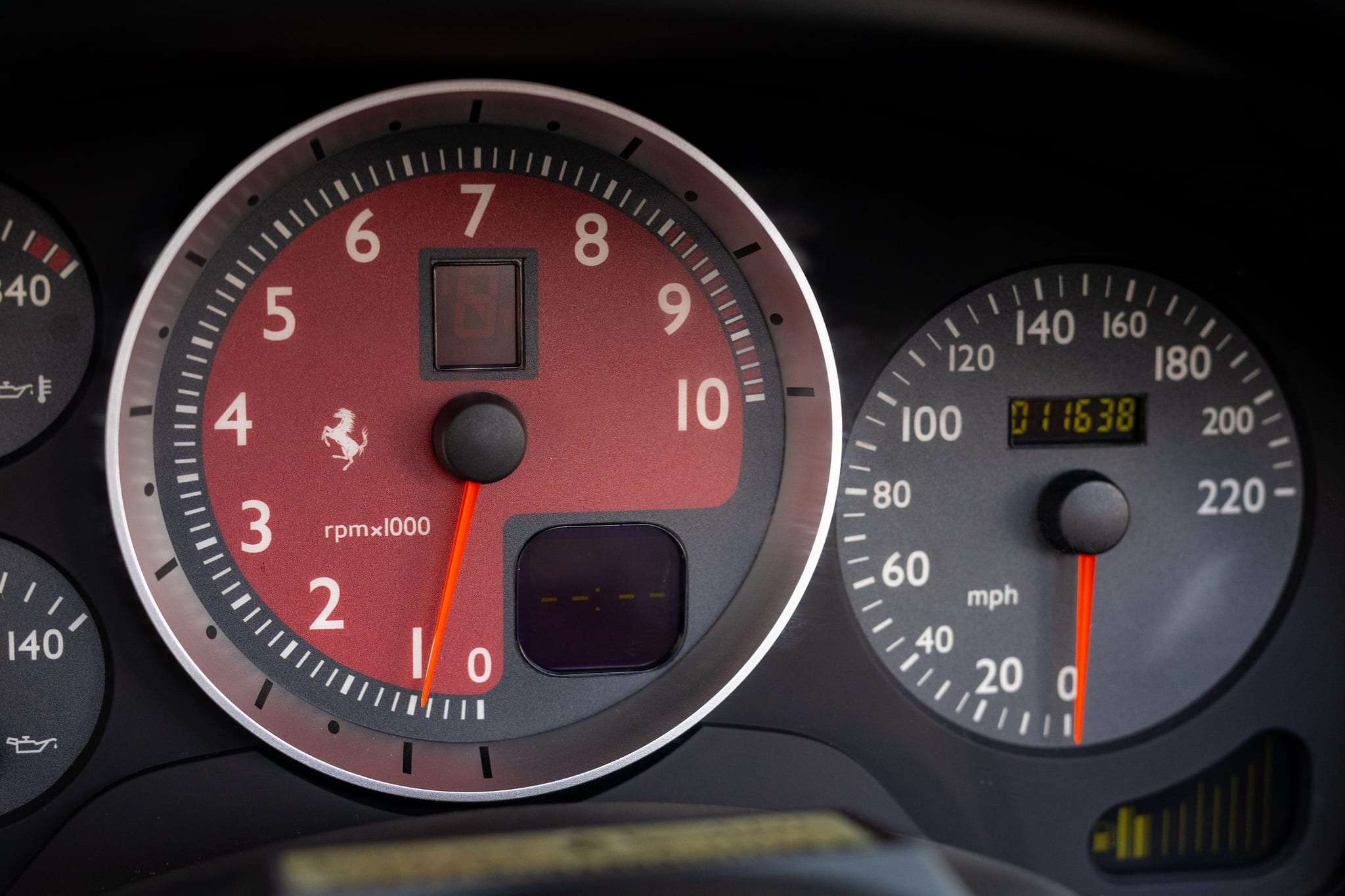 Red-dial tachometer and gauges in 2006 Ferrari F430 Spider