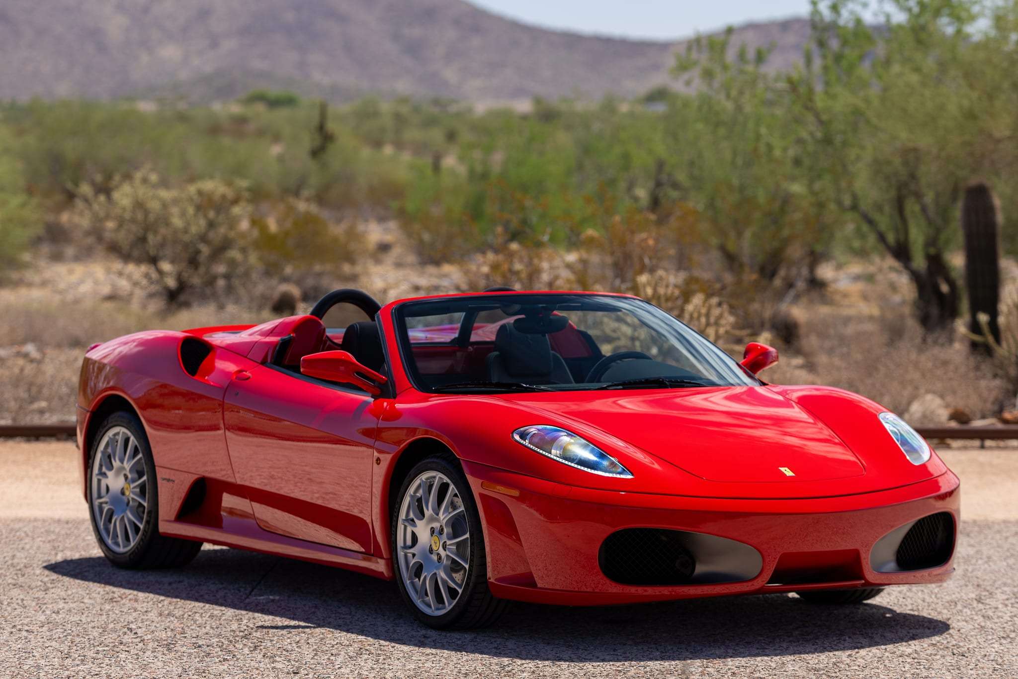 Rosso Corsa 2006 Ferrari F430 Spider with top down, front view
