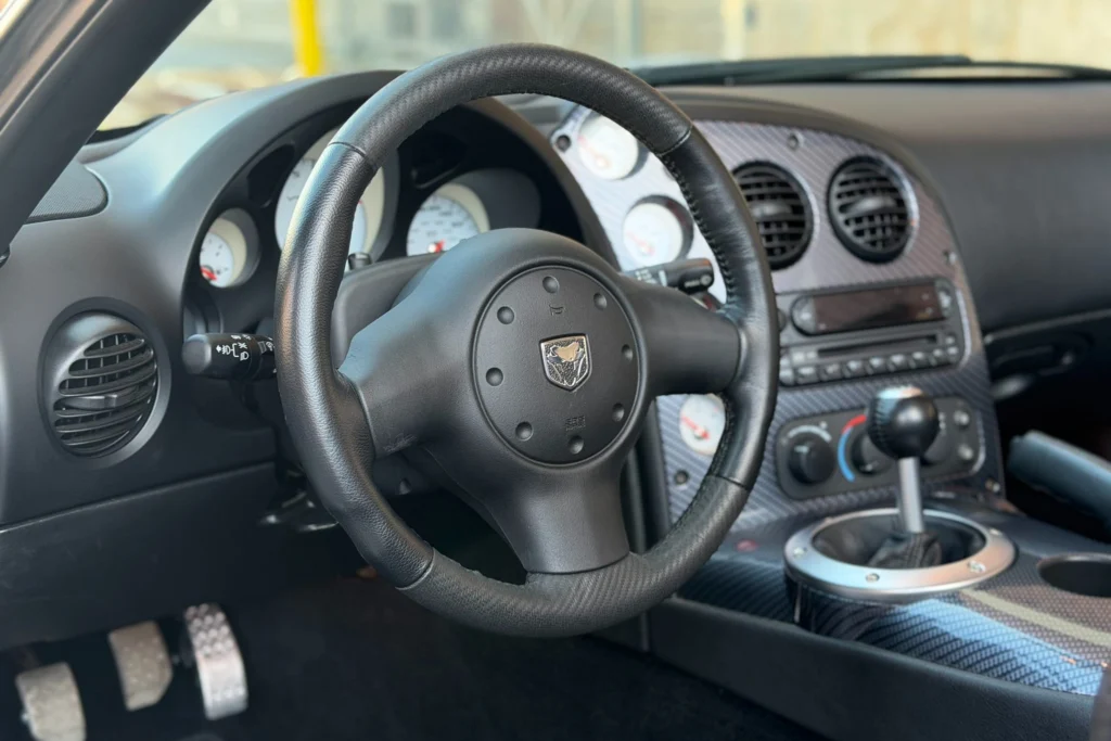 2010 Dodge Viper SRT-10 Roadster cockpit with black leather, 220-mph speedometer and short-throw shifter