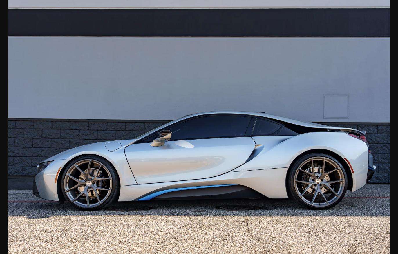 Driver-side profile of the silver 2015 BMW i8 selling at Henderson Auctions