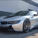 Silver 2015 BMW i8 front three-quarter view offered by Henderson Auctions