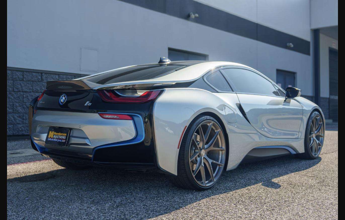 Rear three-quarter view of the 2015 BMW i8 with Vorsteiner carbon-fiber spoiler