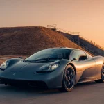 2024 Gordon Murray Automotive T.50 chassis 047 in Harrier grey, front three-quarter view at sunset