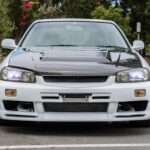 A Modified R34 Skyline Sedan on Cars & Bids Shows Where the JDM Market Draws the Line - featured image