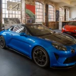 Blue Alpine A110 R with carbon-fibre bonnet displayed indoors at Klassikstadt in Frankfurt