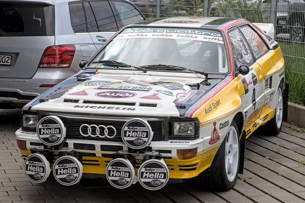 Audi quattro Group B rally car in white, red and yellow livery