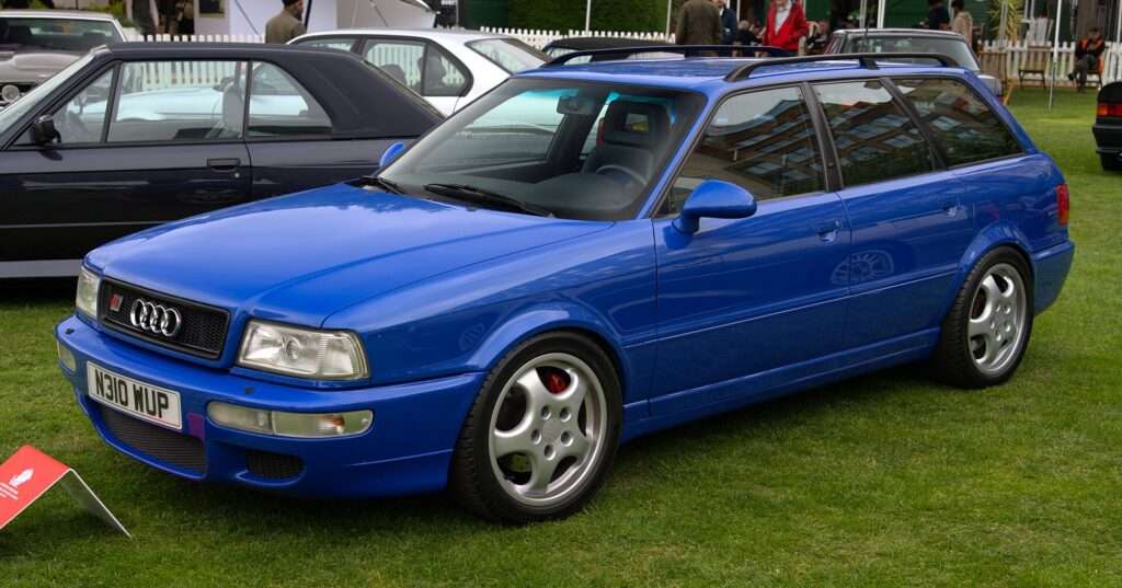 Blue 1995 Audi RS2 Avant wagon on grass at a car show