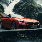 A BMW Z4 M40i roadster with the top down parked on a mountain road
