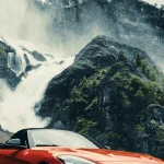 A BMW Z4 M40i roadster with the top down parked on a mountain road