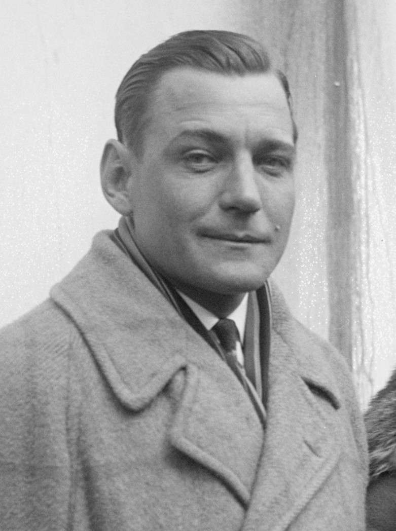 Portrait of Western film star Buck Jones in an overcoat