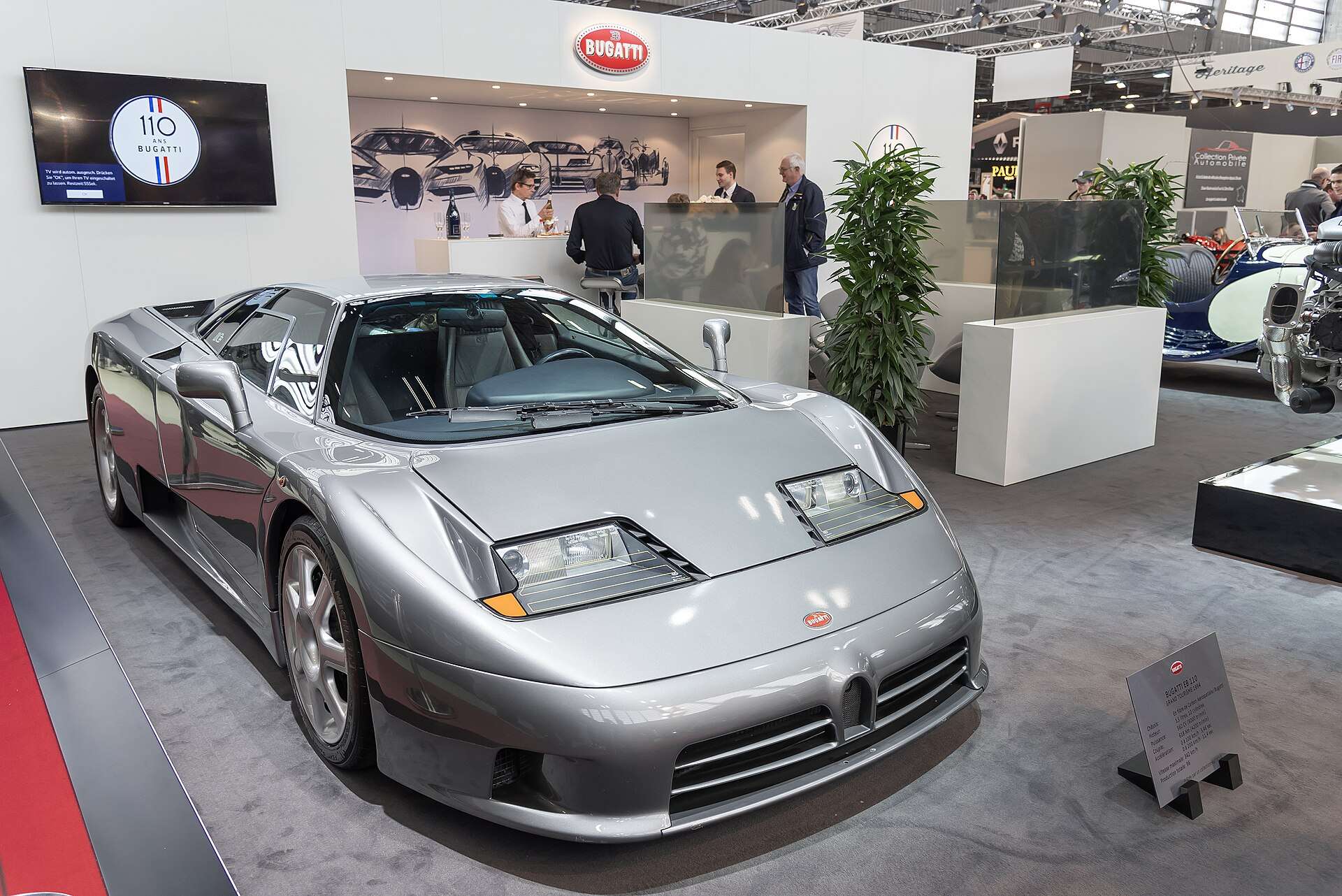 Bugatti EB110 photographed in profile showing its wedge silhouette and scissor doors