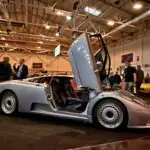 Today in Collector Car History: The Bugatti EB110 Debuted 35 Years Ago Today, and Its Market Now Pays for Paperwork Bugatti EB110 supercar photographed in front three-quarter view with scissor doors closed