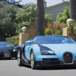 The six Bugatti Veyron Grand Sport Vitesse Les Légendes de Bugatti editions driving at Pebble Beach during Monterey Car Week 2014