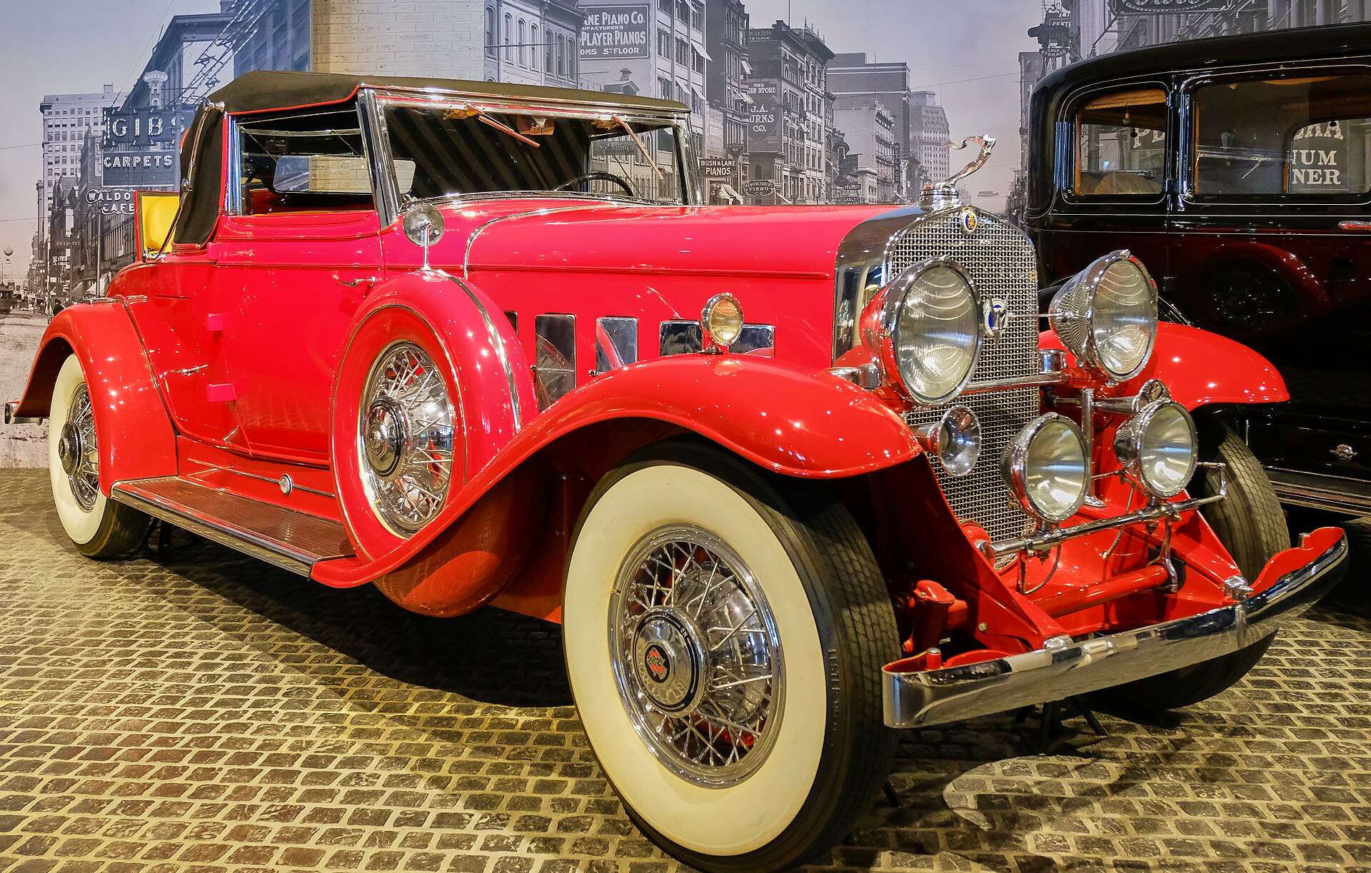 Red Cadillac 370-A V-12 Convertible Coupe by Fleetwood on museum display