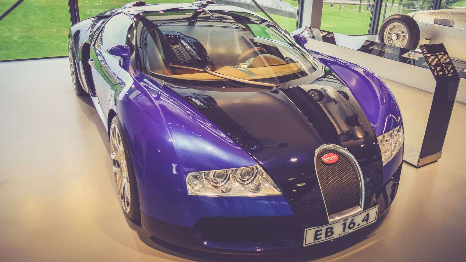 Blue hypercar photographed from a low front angle